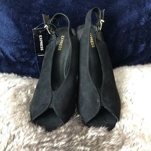 Black suede peep toe heels.